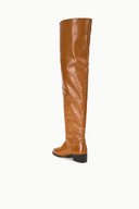 Cashew brown over-the-knee boots with smooth leather-look and black block heel