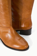 Cashew brown leather-look over-the-knee boots with side seam and black sole