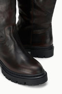 Espresso brown leather boot with stitched welt and chunky black lug outsole