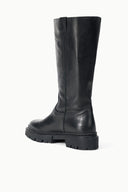Black tall leather boot with rounded toe and chunky tread sole