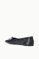 Black leather flats with bow at front and subtle perforation detail