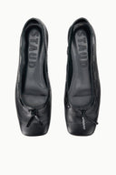Black leather flat ballet shoes, bow detail at toe, branding on insole