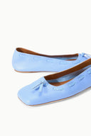 Pair of light blue flat ballet shoes with bow-tied toe and stitched vamp detail
