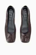 Espresso brown ballet flats with interior logo and bow detail, front view.