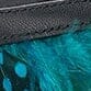 Kitten heel shoe with dark feather trim, close-up detail