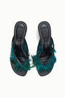 Pair of black kitten-heel mules with teal feather uppers