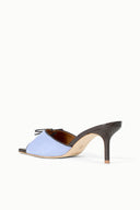 Light blue suede mule sandal with lace-up front and textured dark heel