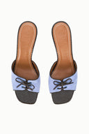 Light blue suede slide mules with lace-up detail and brown leather lining