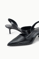 Black snake-texture pointed-toe slingback pumps shown at an angled side view