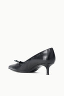 Black leather-look kitten heel pump, side view with bow and seam detailing.
