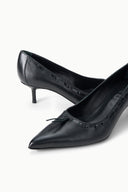 Pair of black kitten heel pumps, pointed toe and bow on textured upper.