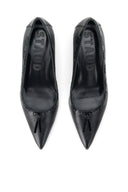 Pair of black leather kitten heel pumps, pointed toes facing front