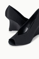 Black satin peep-toe wedge heels, close-up front with open toe and wedge sole