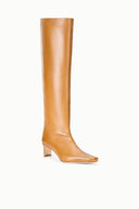Cashew distressed knee-high leather boot with low block heel and pointed toe