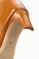 Cashew distressed knee-high boot with printed insole logo on tan lining