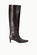 Side view of dark espresso brown knee-high snake-embossed boot with low heel.