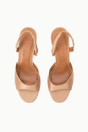 Cashew open-toe heeled sandals pair with slingback straps and low backless profile