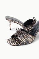 Women's quill-pattern mule with lace-up front and stiletto heel, close-up