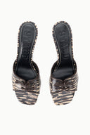 Pair of women's quill-pattern mules with lace-up bows and pointed toe, heel view