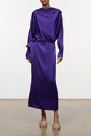 Purple silk midi dress with draped cowl neck, long batwing sleeves, and waist tie