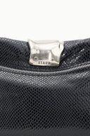 Black snake-texture clutch close-up with silver-tone clasp and top zipper