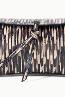 Quill clutch front with black strap pull and attached tassel