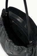 Black oversized bag interior with zip pocket and stitched lining