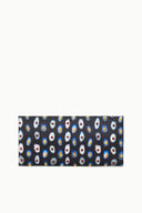 Navy glasswork clutch with colorful floral medallion pattern, slim rectangular design