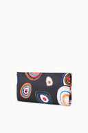Black clutch with colorful paisley print and visible side fold seam.