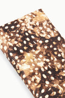 Close-up of fawn haircalf clutch fabric with brown and tan speckled spots