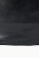 Black hobo bag with embossed STAUD logo near bottom front
