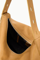 LEVI cashew tan hobo bag interior with black lining and zip pocket