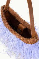 Light-blue feather fringe tote with bronze leather interior and top handle