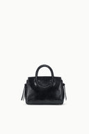 Maude mini carryall bag in black textured leather, top handle and side tassel pulls