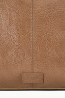 HESTER satchel leather close-up, vertical seam and stitched patch at bottom front