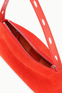 Orange shoulder bag showing dual zipper openings and red-lined interior