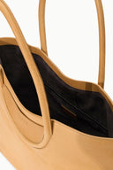 Cashew tan tote open to show black interior pocket with zipper
