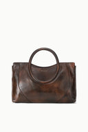 Espresso brown distressed leather satchel with oval top handle and curved front panel