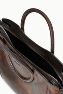 Espresso brown distressed leather satchel showing interior, double zip and dark lining