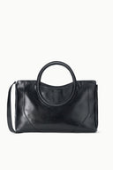 Maude black satchel with top oval handle and front panel seam detail