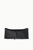 Black clutch bag with smooth finish, tie closure, and short shoulder strap