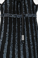 Dark knit bag with vertical beaded stripes and small front logo patch