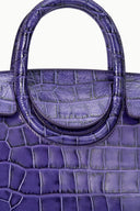 Croc-embossed leather mini carryall bag with deep purple top handle close-up