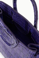 Deep purple croc-embossed carryall bag interior with lined pocket and structured sides