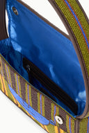 Beaded handbag interior with blue lining and zip pocket, multicolor striped exterior