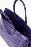 Purple croc-embossed carryall shown open with dark lining and inner pocket