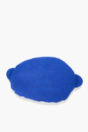 Blue plush floor pillow, side view, with embroidered 4 and circle accents