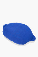 Blue plush floor pillow, angled view, with large stitched 4 emblem