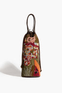 Multicolor beaded wine bottle bag front view, drawstring closure and dark braided handles