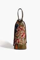 Multicolor beaded wine bottle bag with drawstring top and braided dark handles